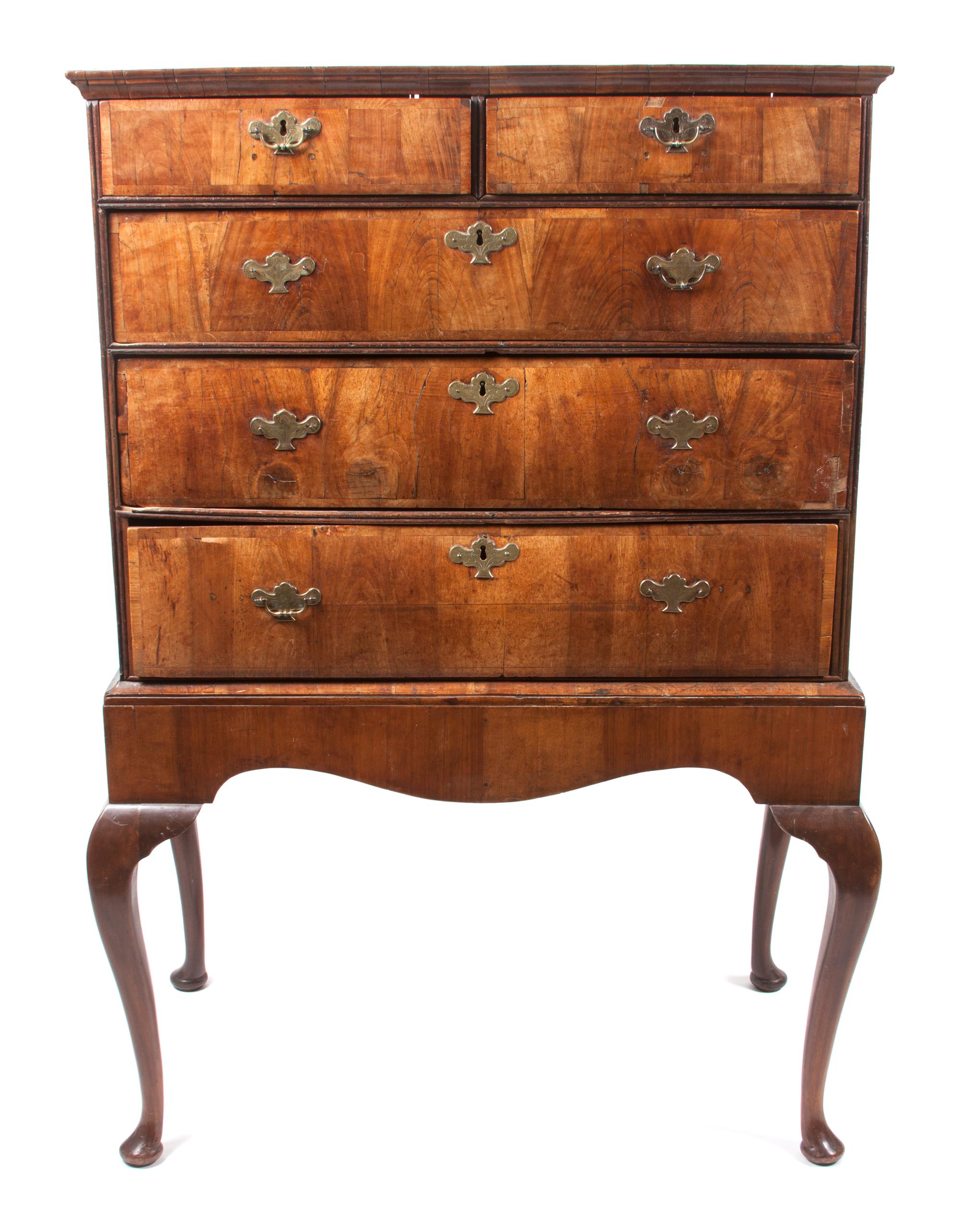 A George I Walnut Chest on Stand Height 55 3/4 x width 37 1/2 x depth 20 1/2 inches.