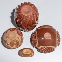 Red and Tan Carved Pottery