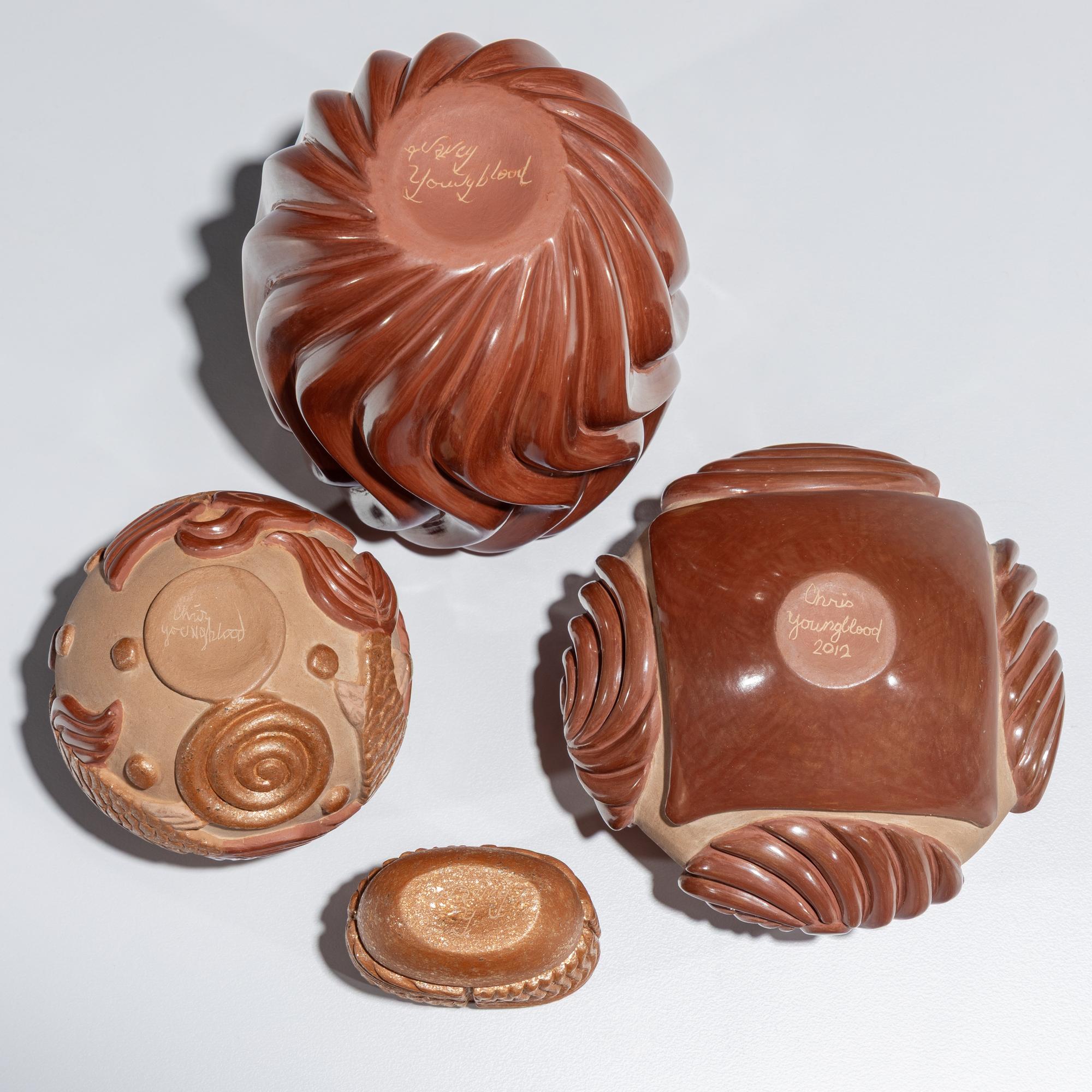 Red and Tan Carved Pottery