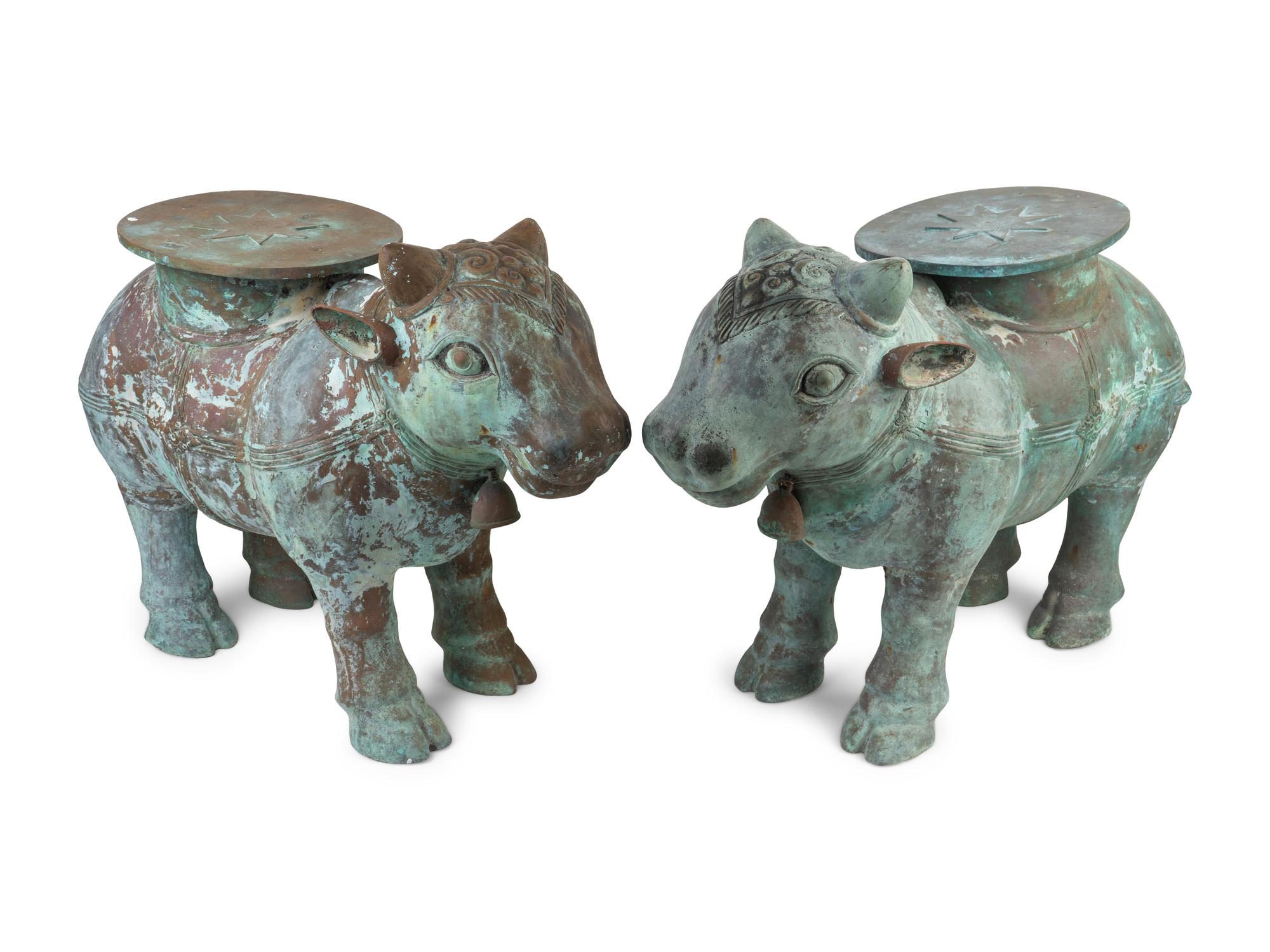 A Pair of Indian Sacred Cow-Form Metal Garden Seats