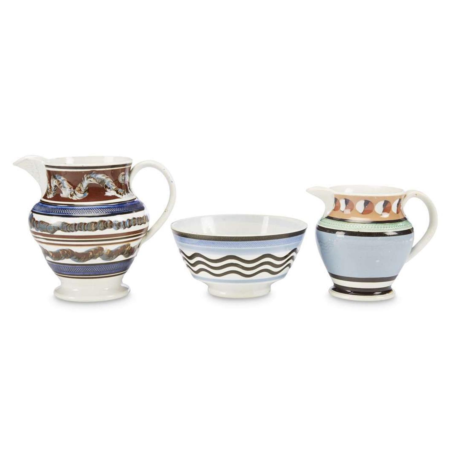 Three engine-turned and slip-decorated Mochaware items England, early 19th century