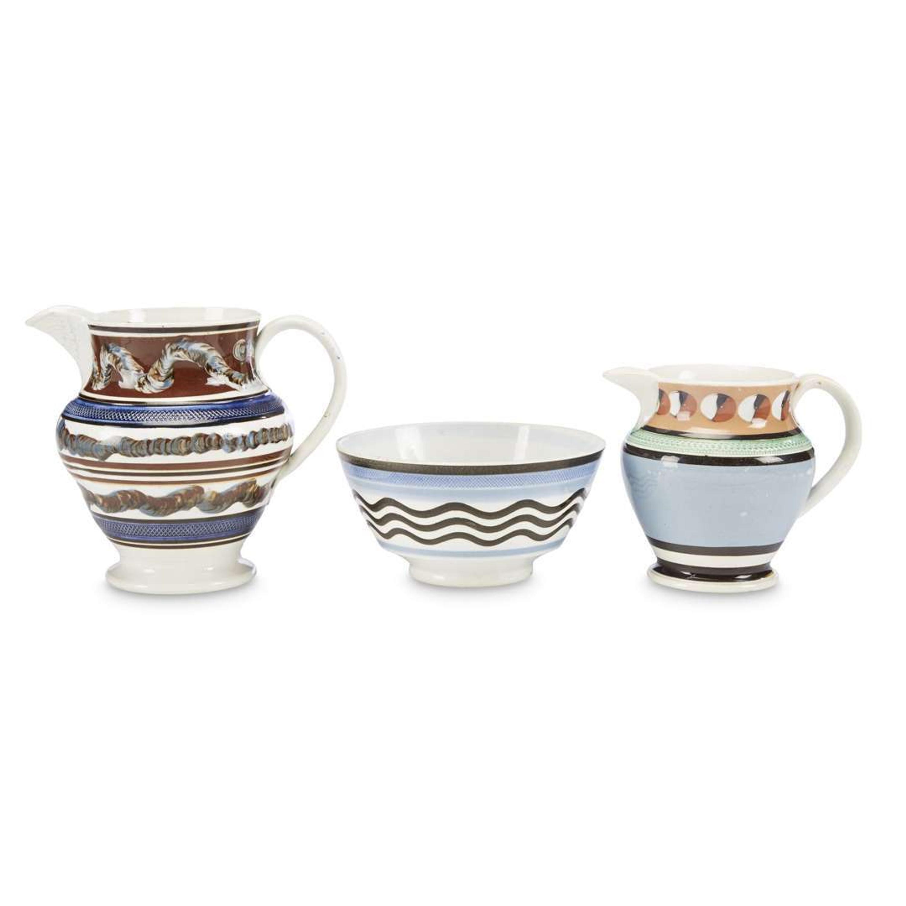 Three engine-turned and slip-decorated Mochaware items England, early 19th century