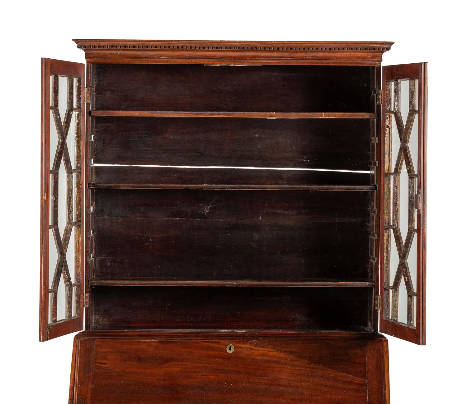 A Chippendale Mahogany and Cherrywood Serpentine Claw-and-Ball Foot Desk-and-Bookcase
