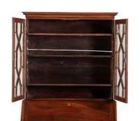 A Chippendale Mahogany and Cherrywood Serpentine Claw-and-Ball Foot Desk-and-Bookcase