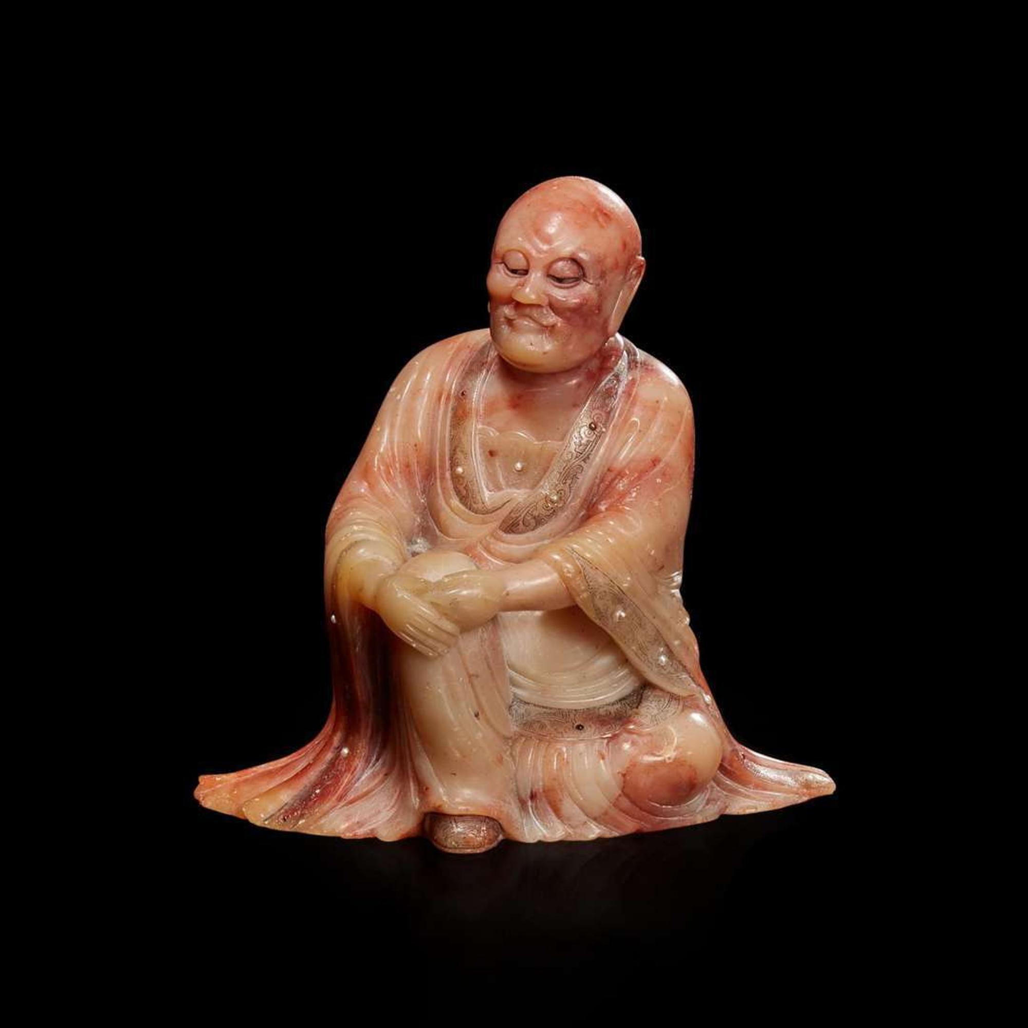 A finely-carved Chinese beige and rose soapstone figure of a seated lohan 壽山石雕羅漢 Qing dynasty, 18th/19th century ? ???????