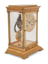 A Continental Gilt Bronze and Champlevé Mantel Clock