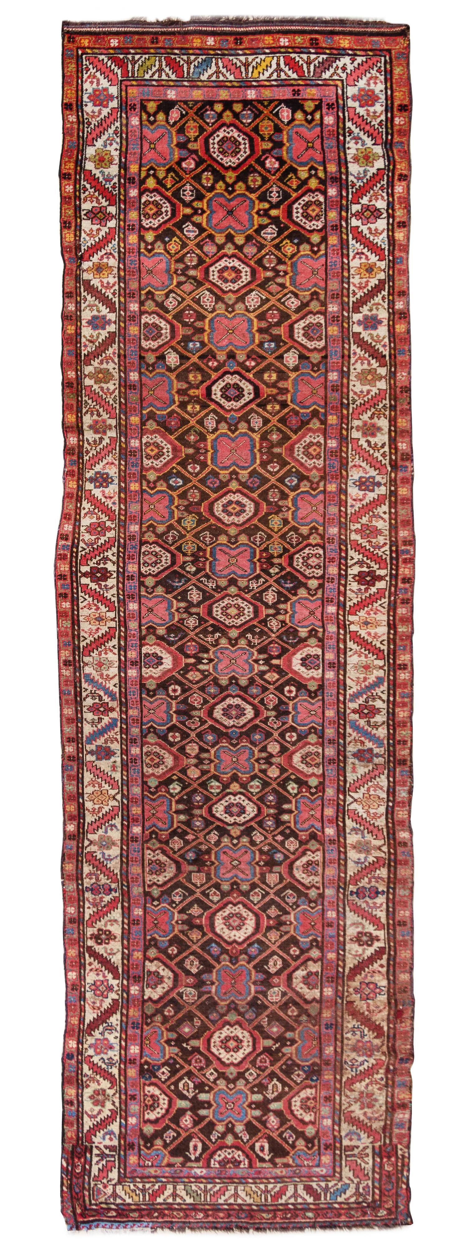 A Kurdish Wool Runner 13 feet 3 inches x 3 feet 5 inches. — EARLY 20TH CENTURY