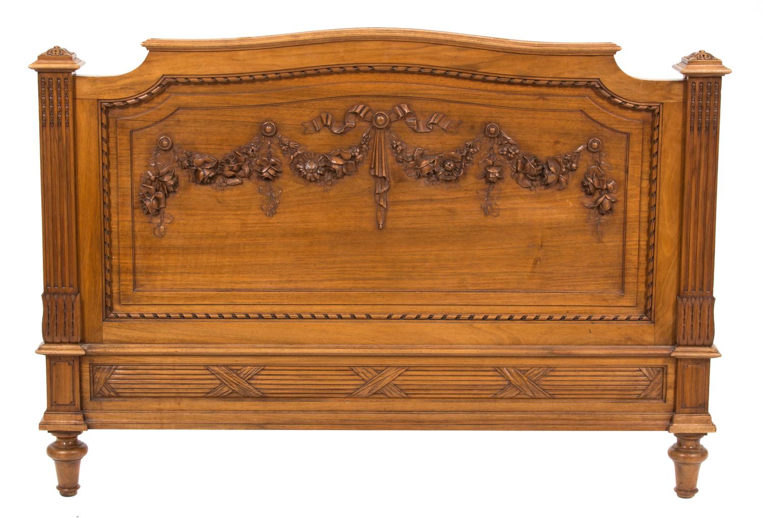 A Pair of Louis XVI Style Carved Walnut Twin Beds Height of headboard 58 inches x width 43 1/2 inches. — 19TH CENTURY
