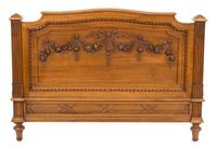A Pair of Louis XVI Style Carved Walnut Twin Beds Height of headboard 58 inches x width 43 1/2 inches. — 19TH CENTURY