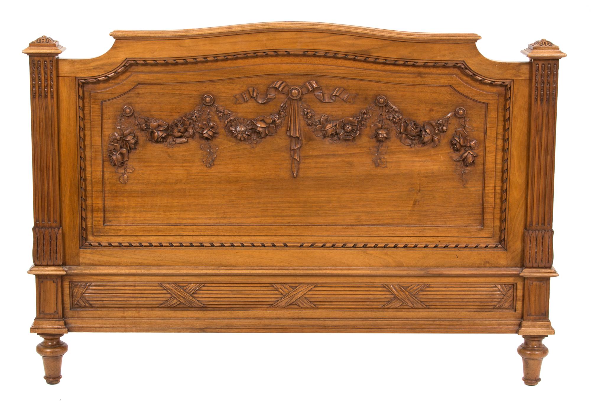 A Pair of Louis XVI Style Carved Walnut Twin Beds Height of headboard 58 inches x width 43 1/2 inches. — 19TH CENTURY