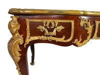 A Louis XV Style Gilt Bronze Mounted Kingwood Bureau Plat