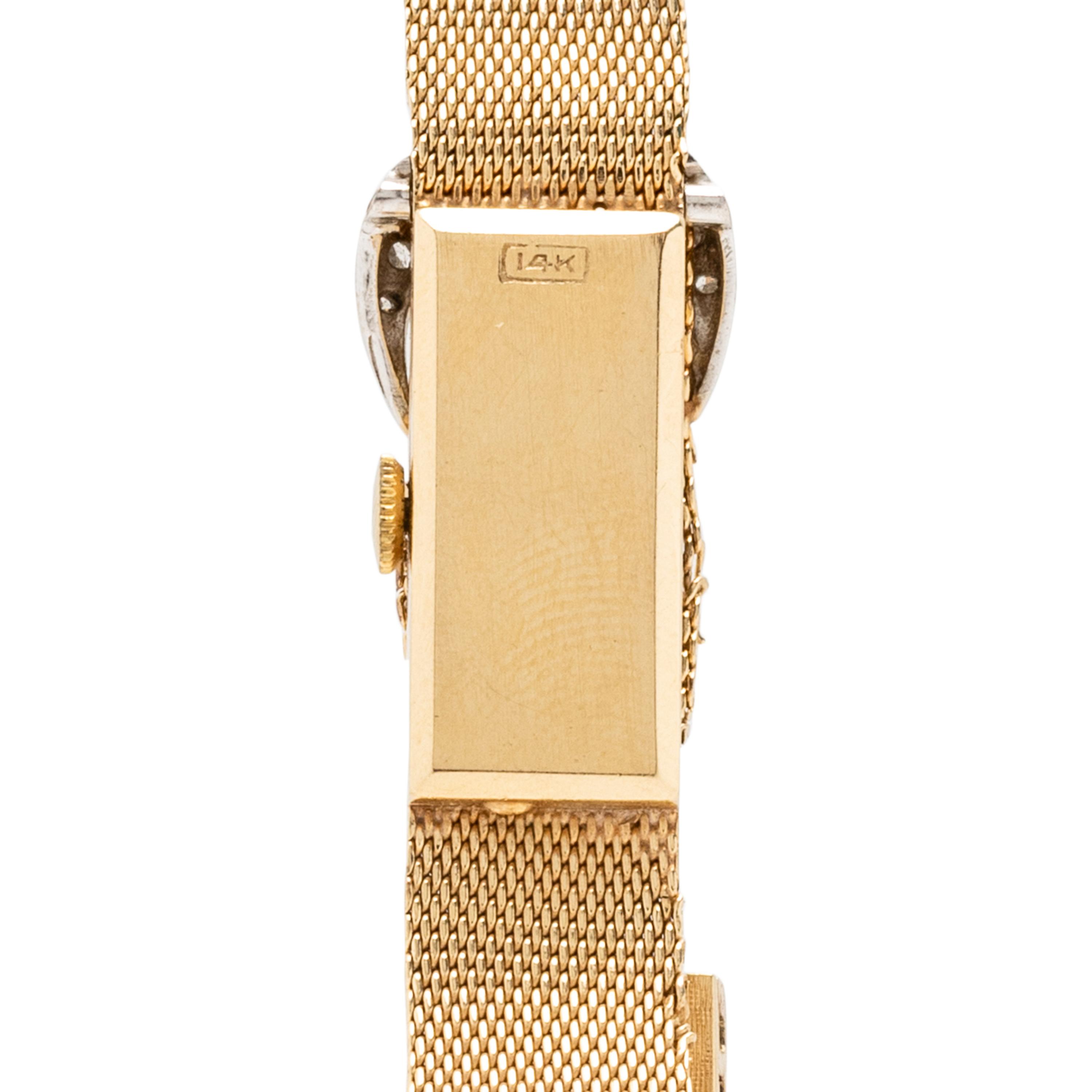 Croton, Nivada Grenchen, 14K Yellow Gold and Diamond Buckle Surprise Watch