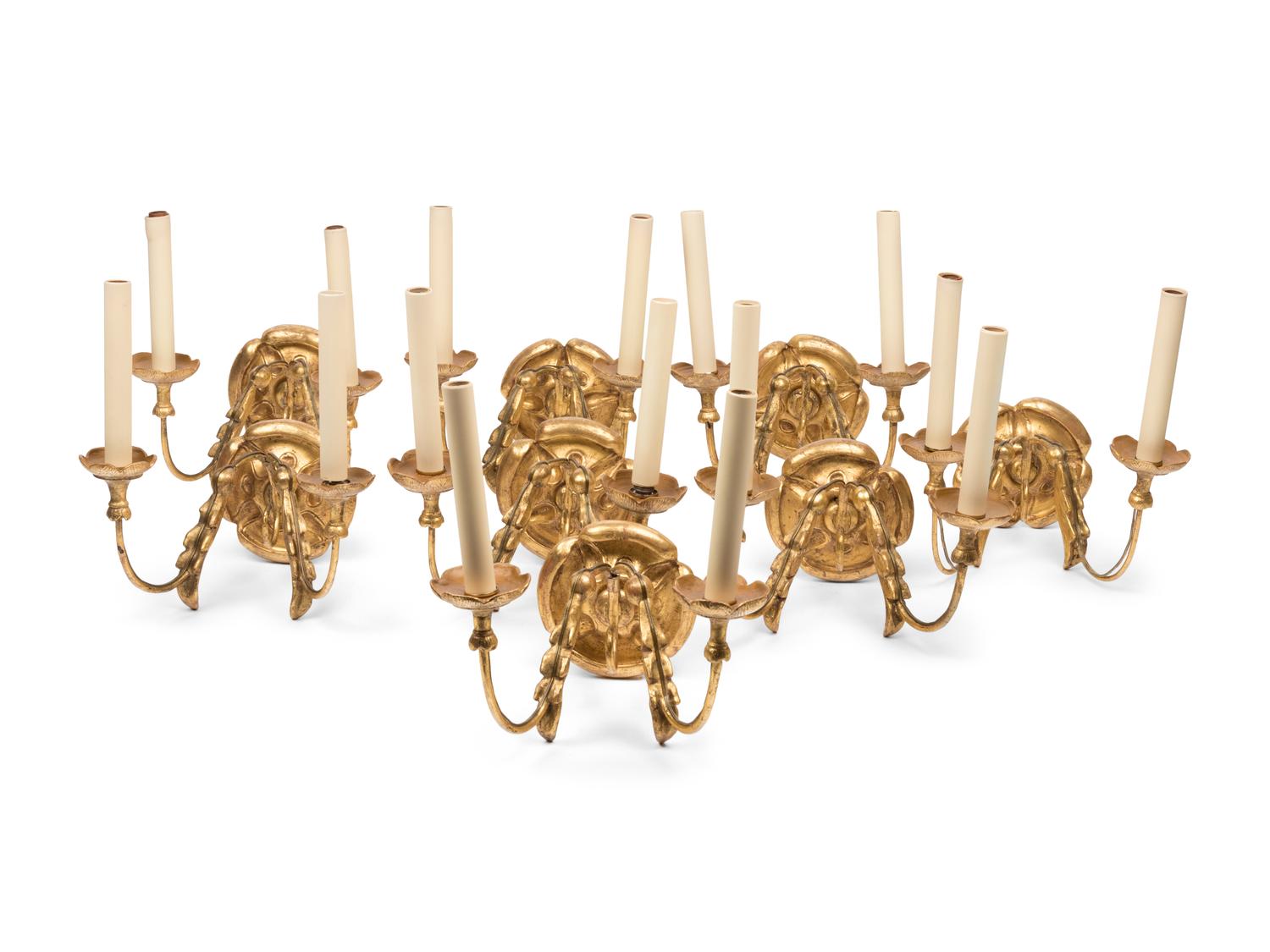 A Set of Eight Continental Giltwood Three-Light Sconces