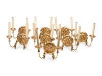 A Set of Eight Continental Giltwood Three-Light Sconces