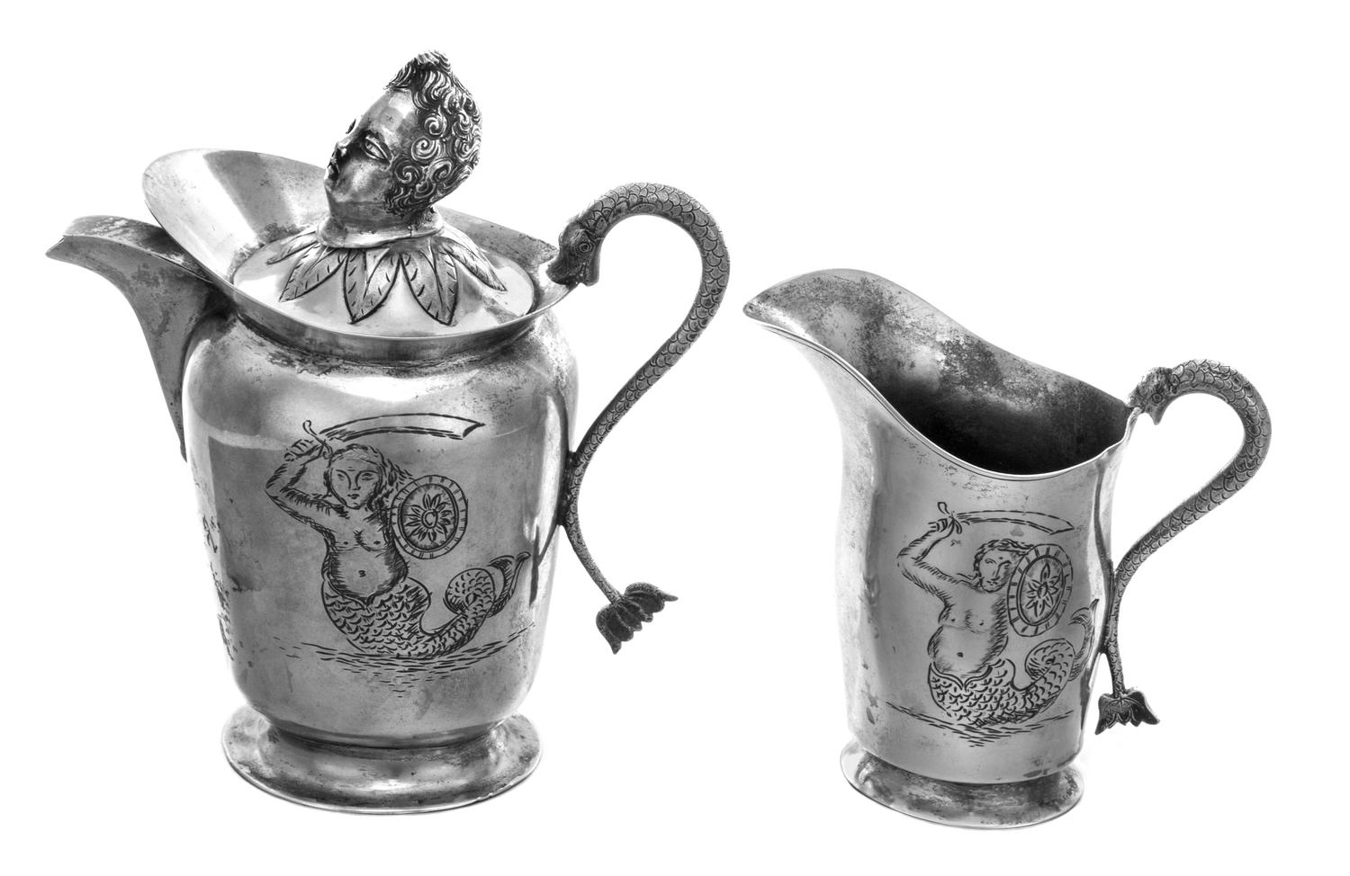 Two Polish Silver Creamers, 18th Century, the larger example lidded and having a finial in the form of a putto's head, both engraved wi