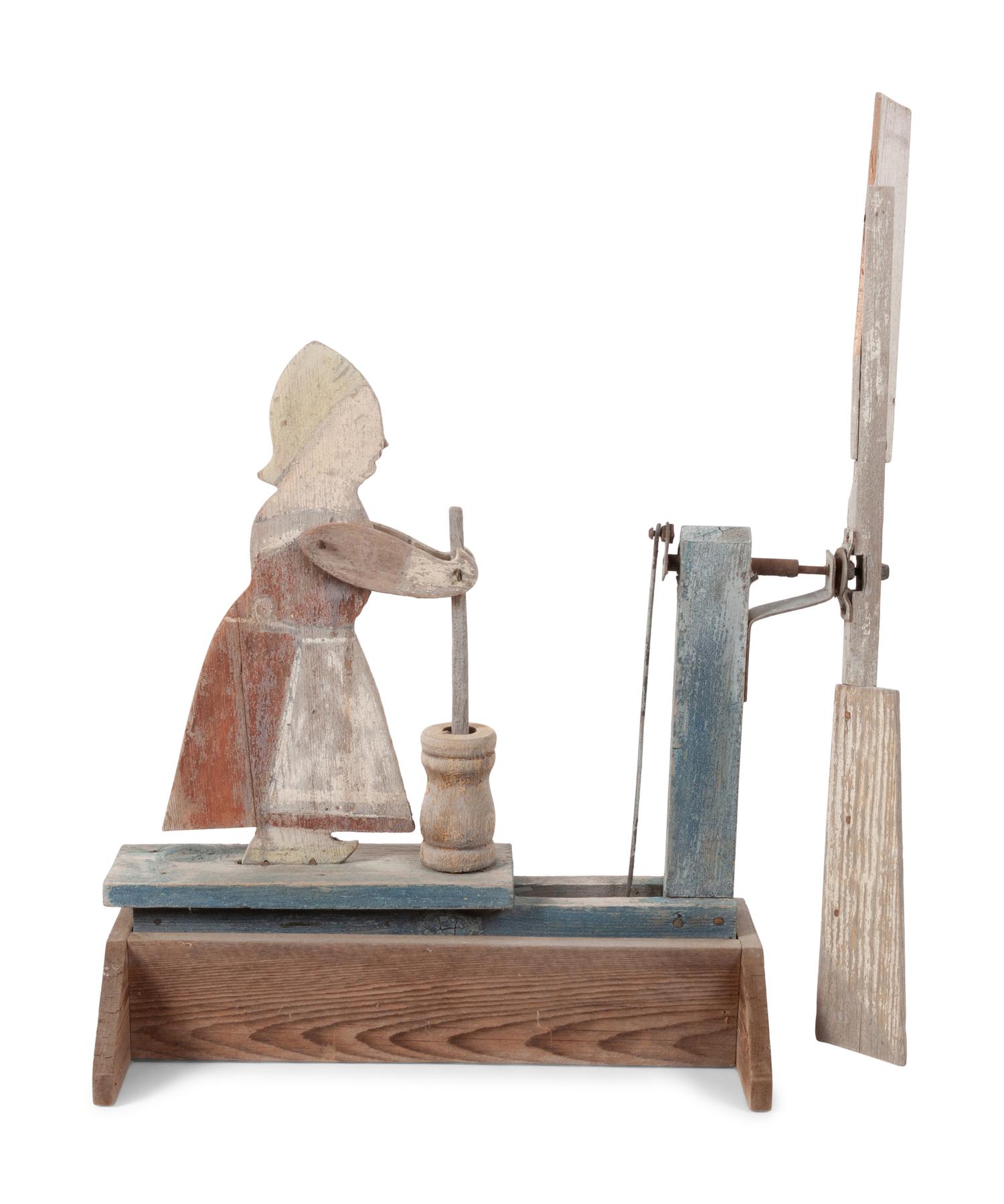 A Folk Art Carved and Painted Wood Butter Churn Whirligig