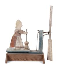 A Folk Art Carved and Painted Wood Butter Churn Whirligig