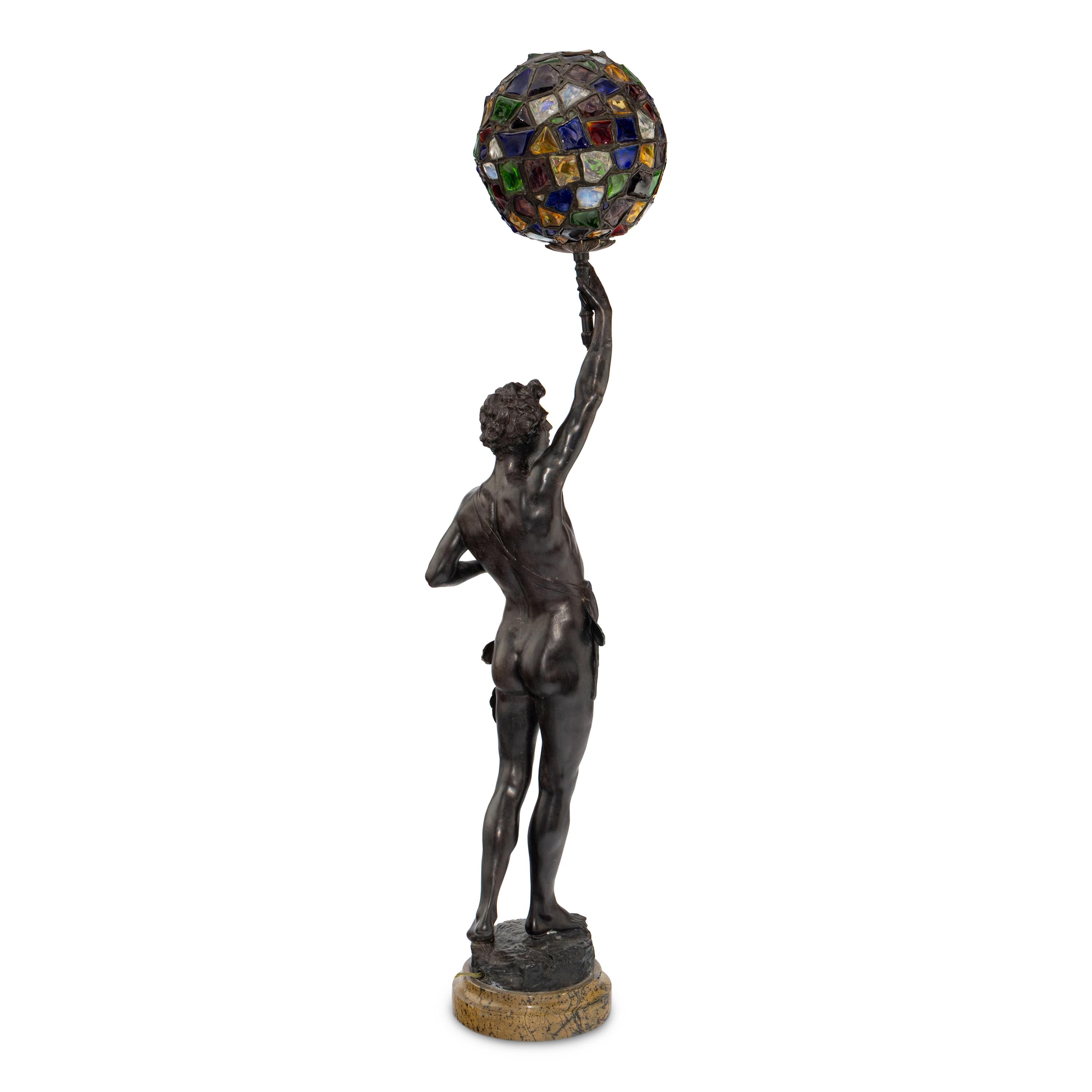 A French Cast Metal and Colored Glass Figural Lamp