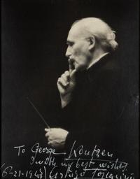 TOSCANINI, Arturo (1867-1957). Black and white photographic portrait, signed (“Arturo Toscanini”) and additionally inscribed to George Koutzen, 21 June 1947.