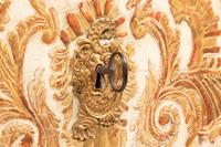 A Portuguese Baroque Gilt Bronze Mounted Painted and Parcel Gilt Commode