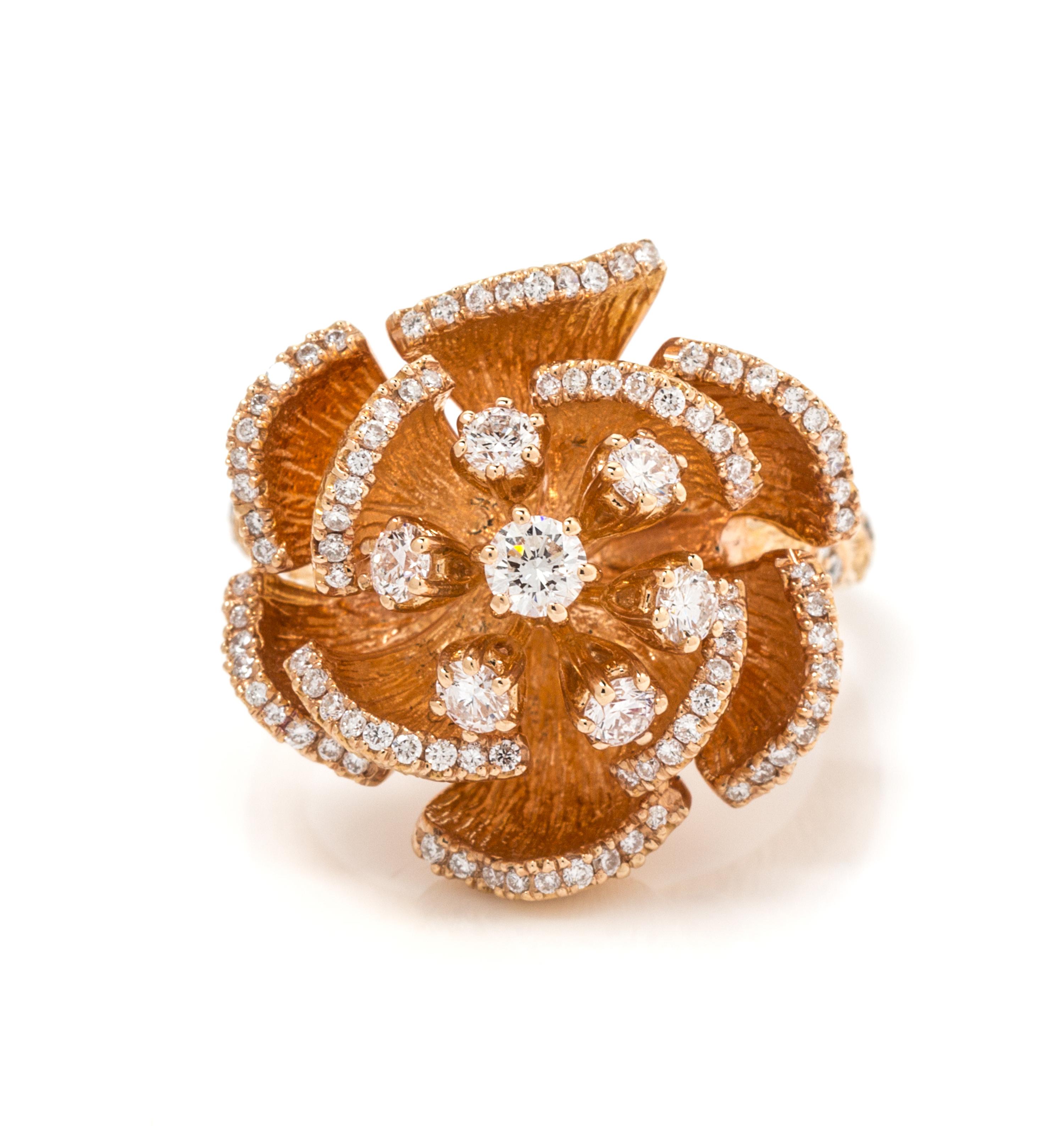 A 14 Karat Rose Gold and Diamond Flower Motif Ring, 9.50 dwts.