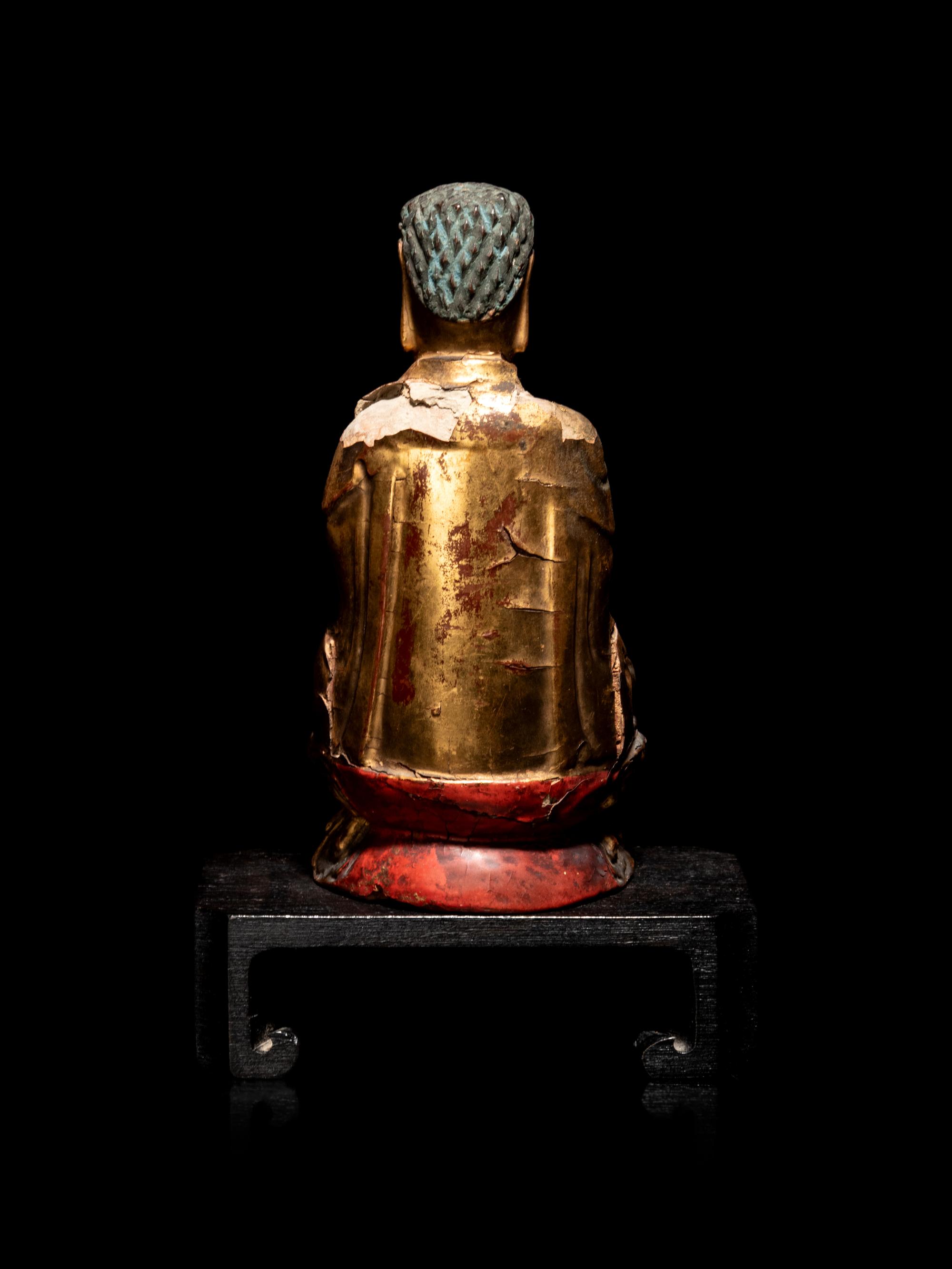 A Small Chinese Gilt Lacquered Wood Figure of Buddha Shakyamuni