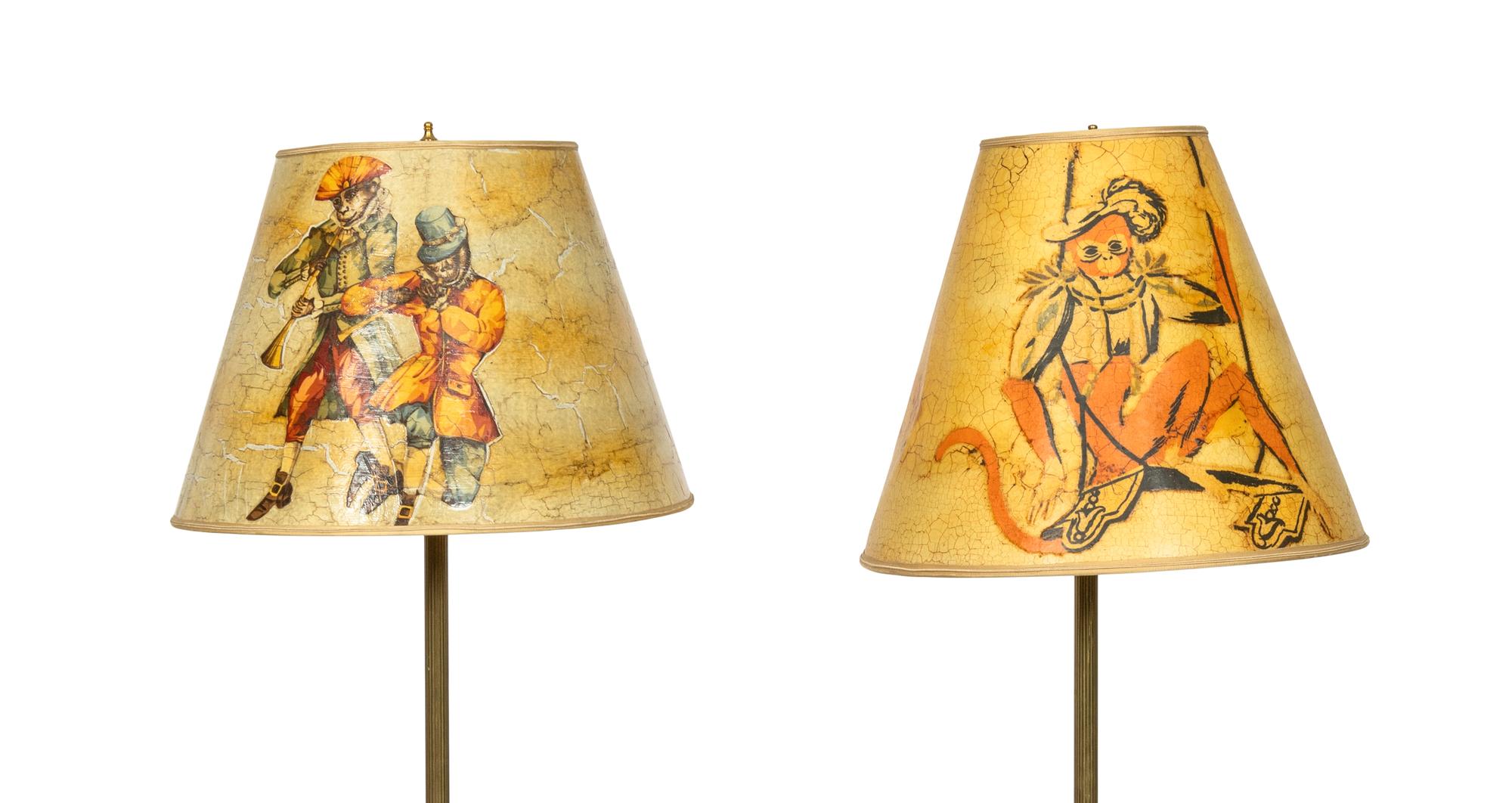 A Pair of Ebonized Parcel Gilt Floor Lamps with Papier Mache Shades