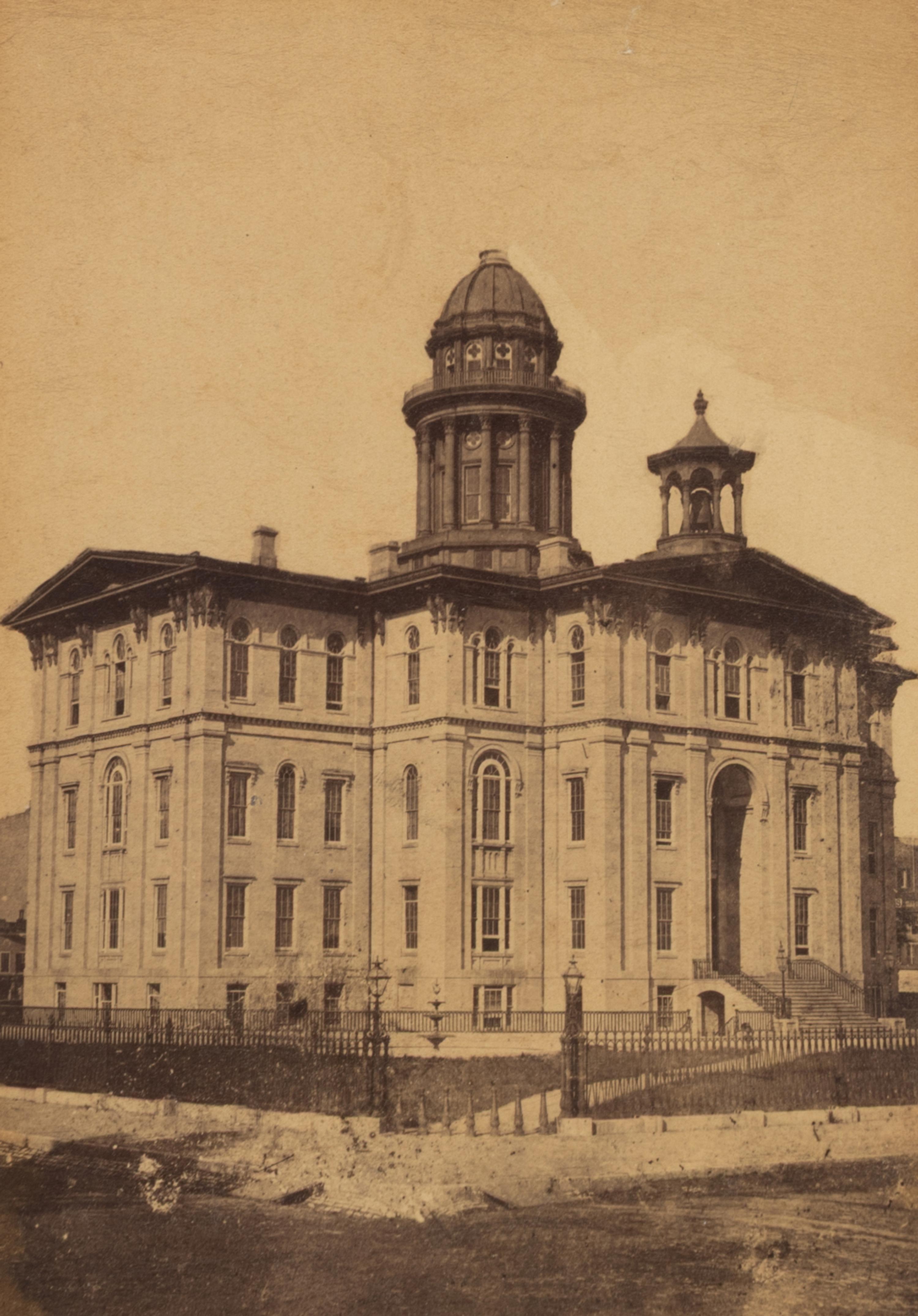 [Chicago Fire]. A group of 7 albumen prints taken before and after the 1871 Chicago Fire, comprising: