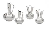 A Group of Four Native American Silver Vessels, Wesley K. Whitman, Navajo, comprising two wedding vases and a single spout ewer, togeth