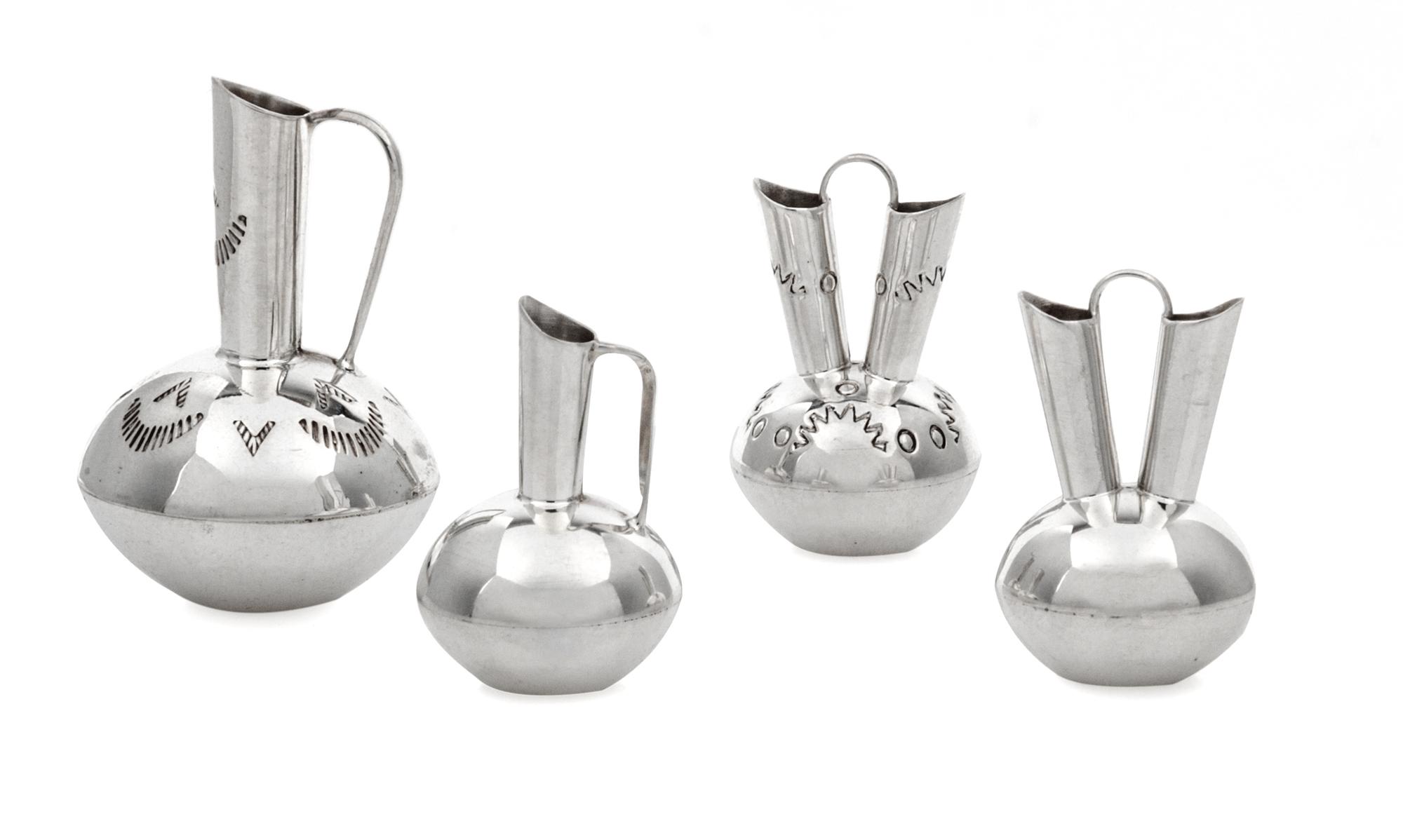 A Group of Four Native American Silver Vessels, Wesley K. Whitman, Navajo, comprising two wedding vases and a single spout ewer, togeth