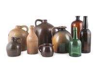 A Group of Stoneware Jugs and Glass Bottles