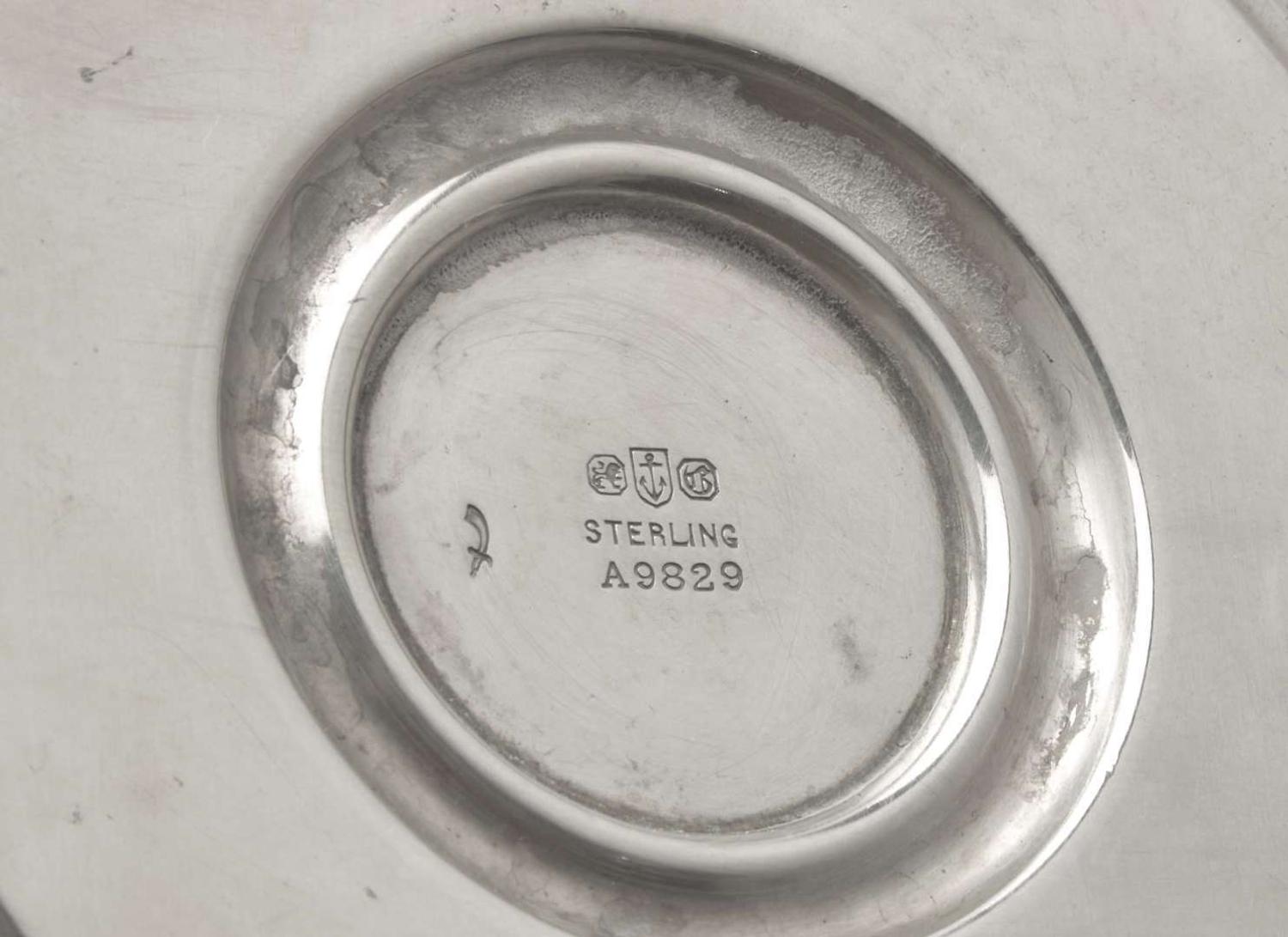 A set of four Neoclassical weighted sterling silver candlesticks, Gorham Mfg. Co, Providence, RI, bearing date mark for 1917