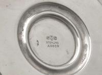 A set of four Neoclassical weighted sterling silver candlesticks, Gorham Mfg. Co, Providence, RI, bearing date mark for 1917