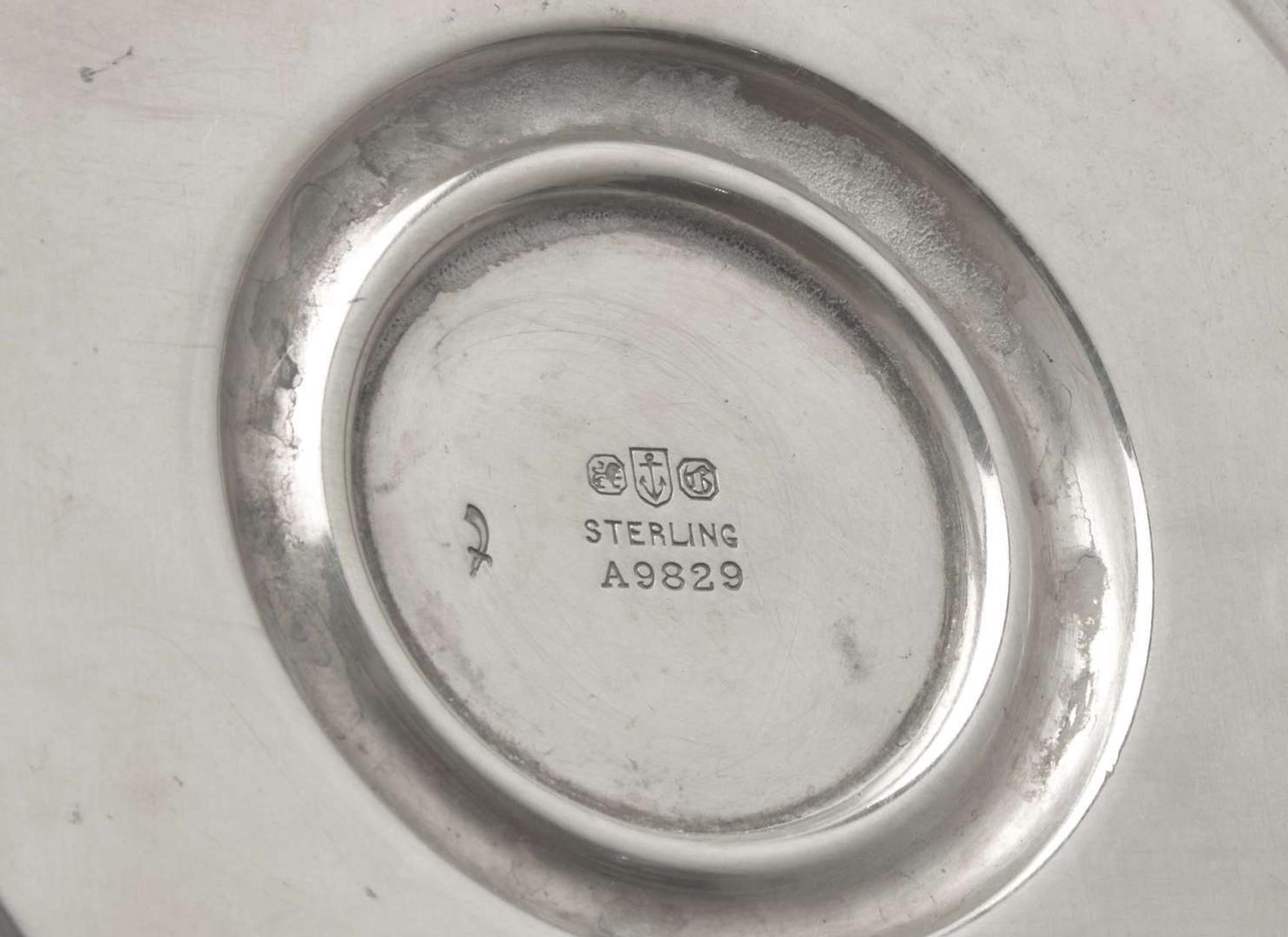 A set of four Neoclassical weighted sterling silver candlesticks, Gorham Mfg. Co, Providence, RI, bearing date mark for 1917