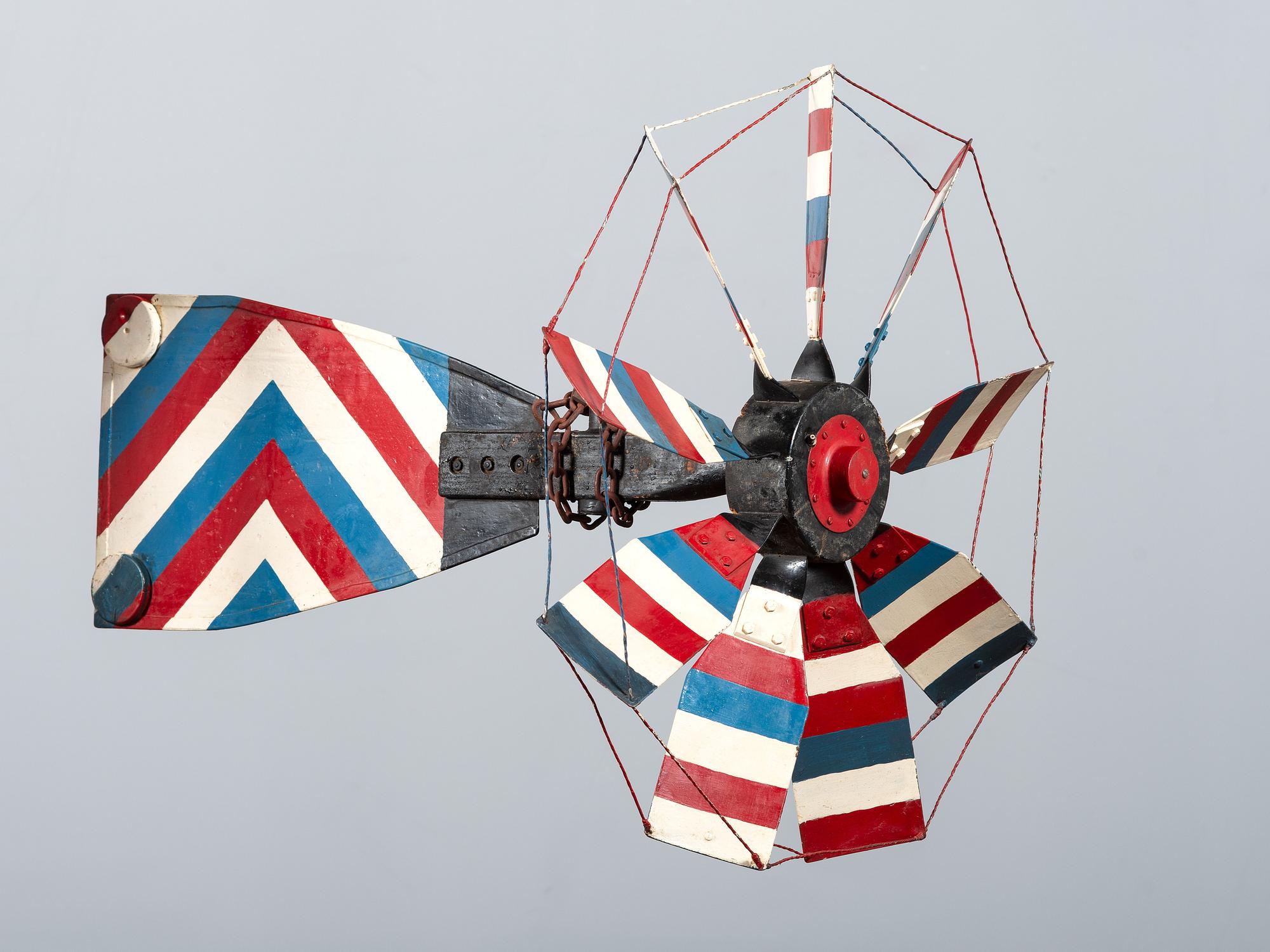 A Patriotic Red, White and Blue Painted Sheet Metal Whirligig