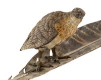 An Austrian Cold-Painted Bronze Figure of a Bird of Prey Perched on a Feather