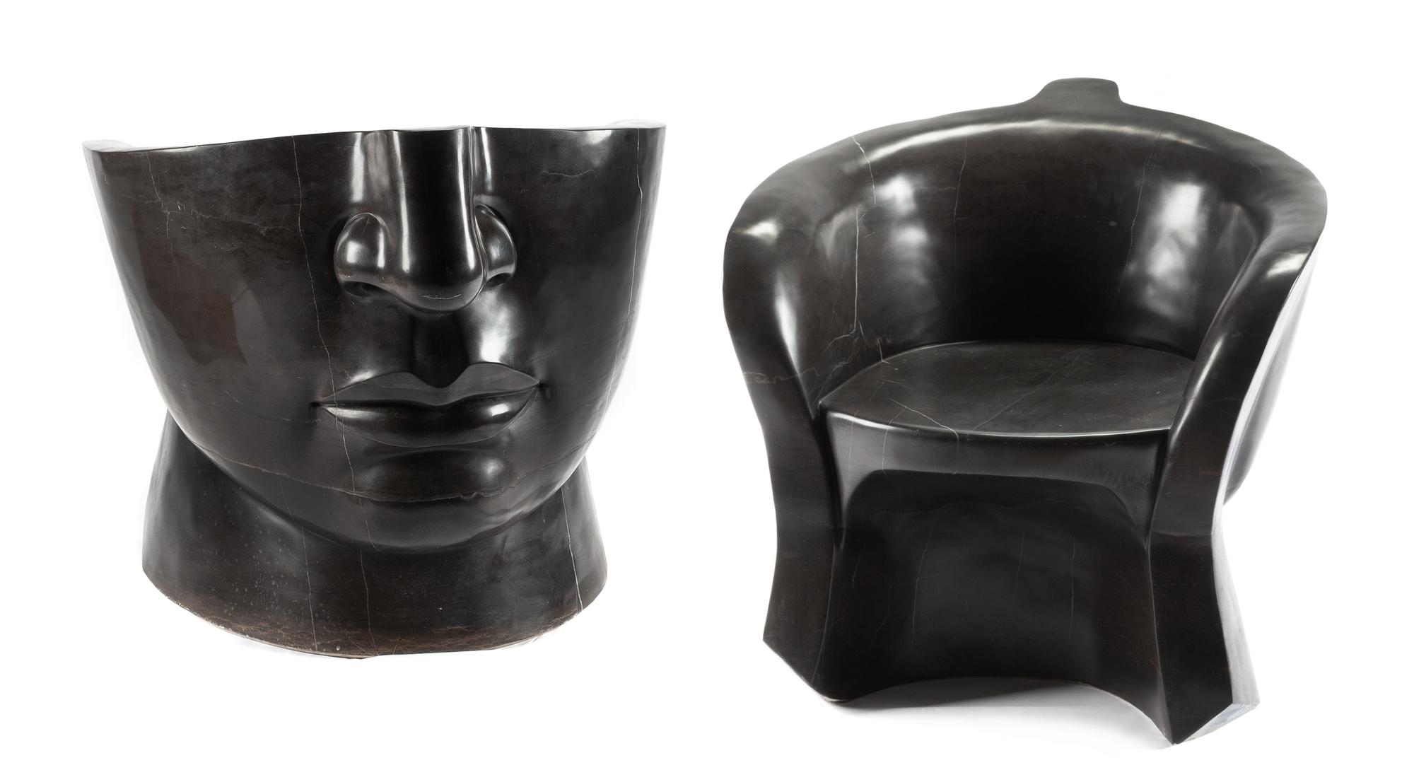 A Pair of Italian Marble "Face" Chairs Height 27 x width 27 1/2 x depth 27 inches.