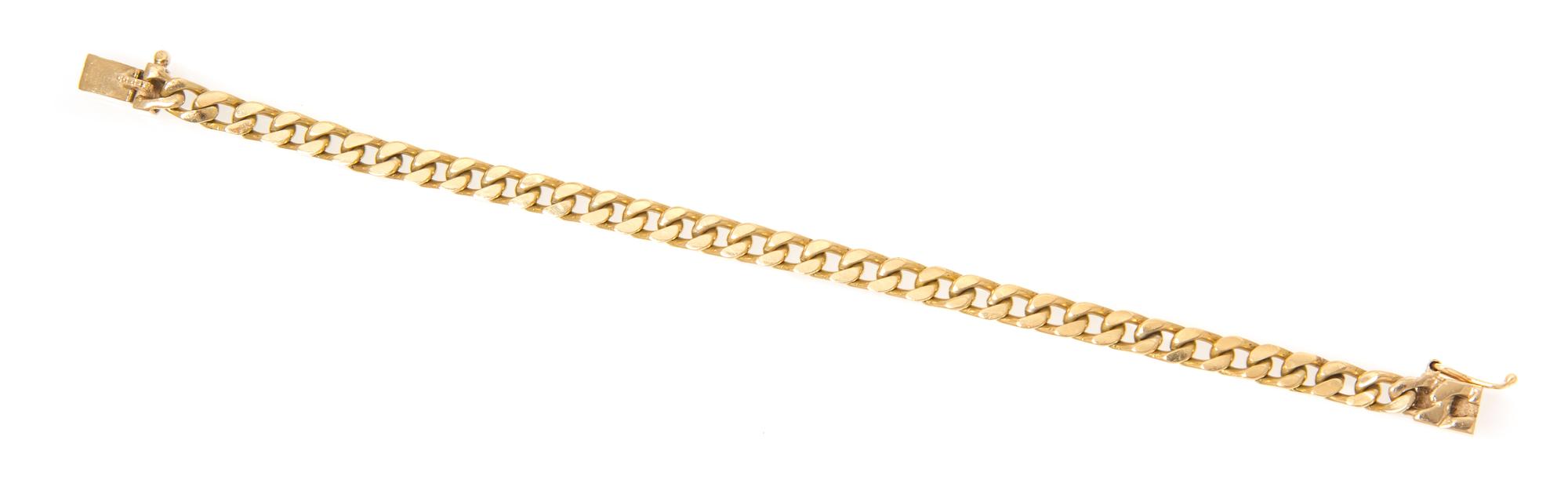 A 14 Karat Yellow Gold Curb Link Chain Bracelet. 11.50 dwts.