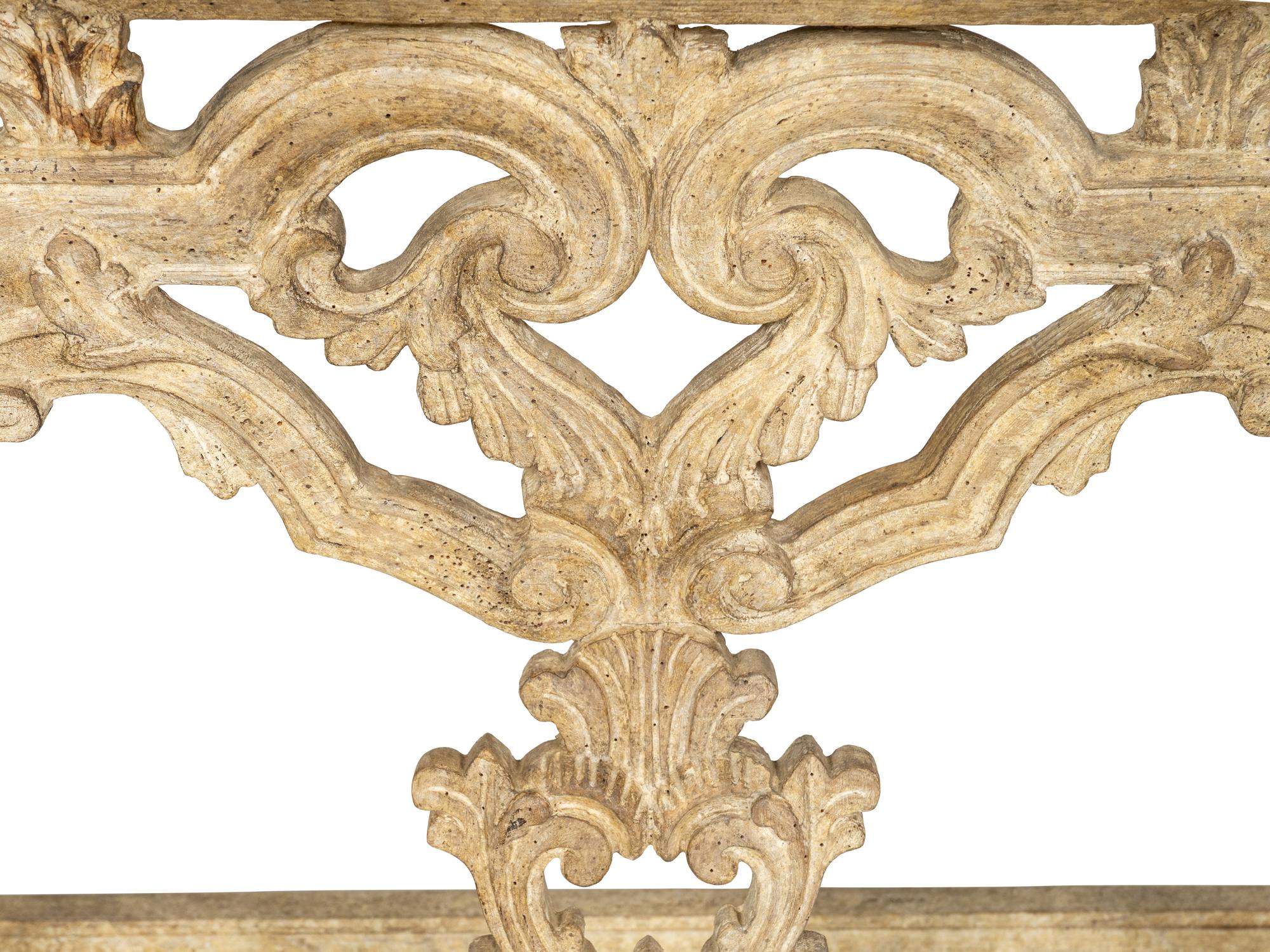 A Pair of Venetian Style Cream-Painted Marble Top Consoles