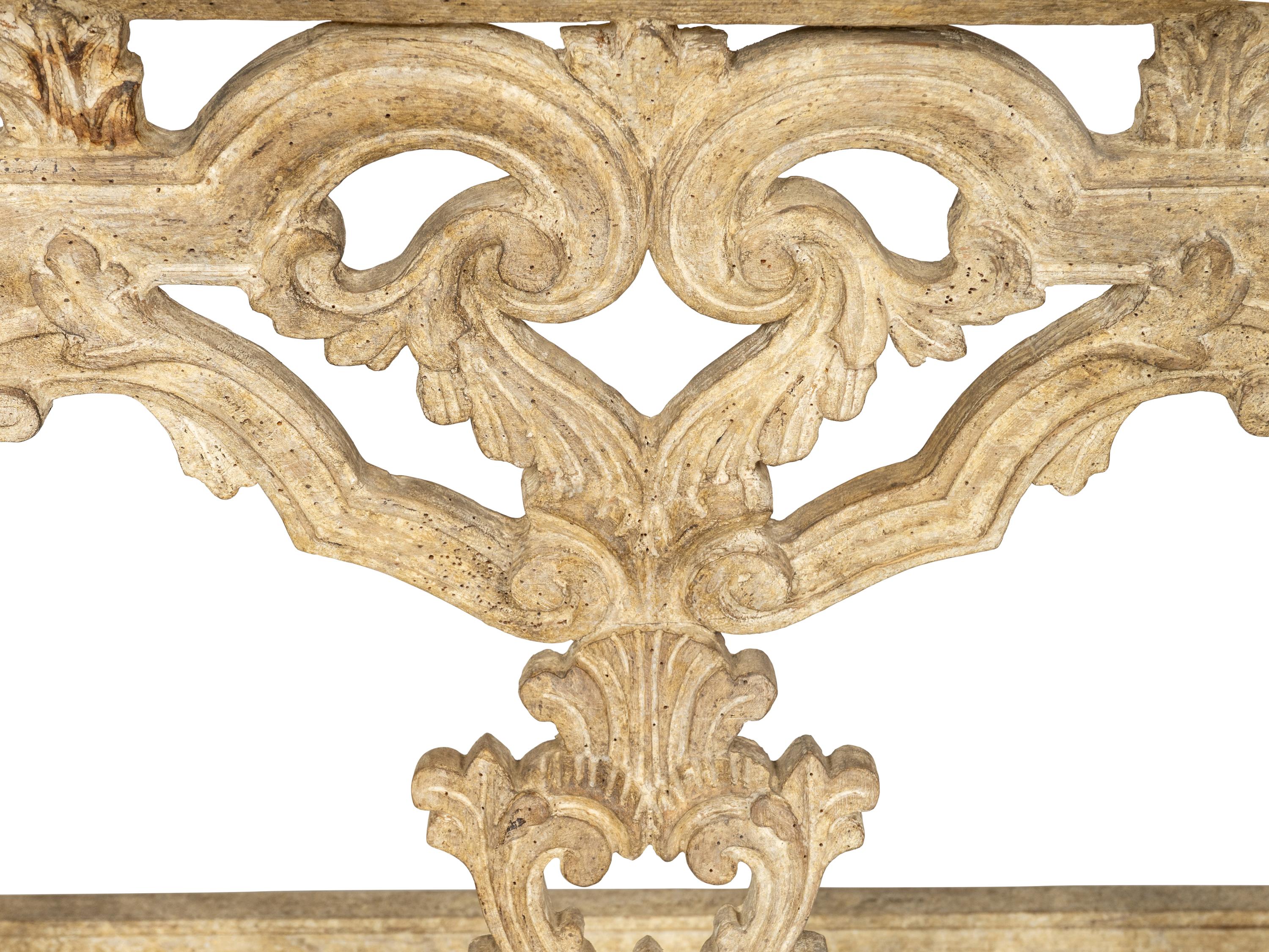 A Pair of Venetian Style Cream-Painted Marble Top Consoles