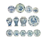 A Group of Thirteen Delft Earthenware Plates and Chargers