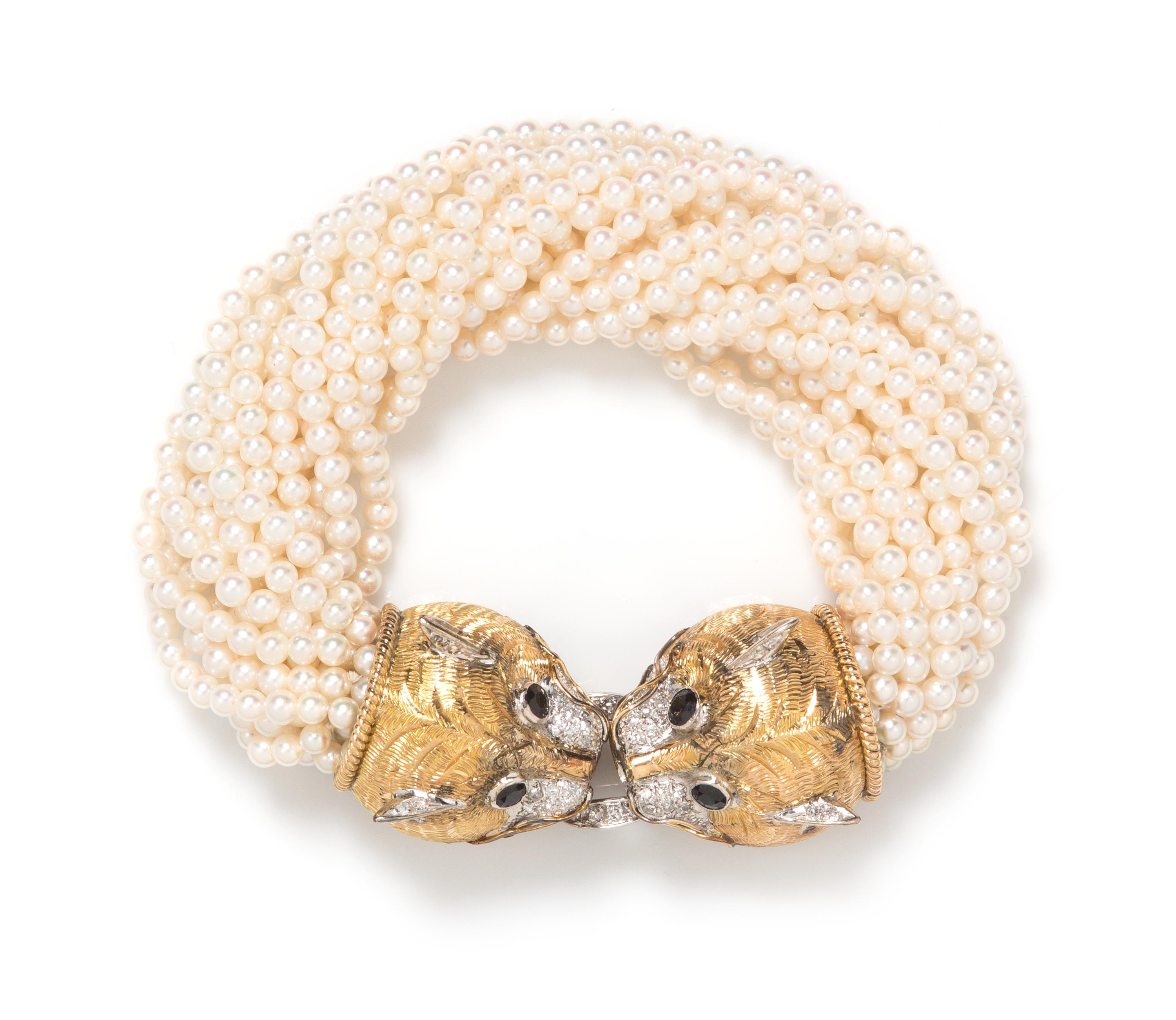 An 18 Karat Gold, Diamond, Sapphire and Cultured Pearl Multistrand Bracelet, 48.50 dwts.