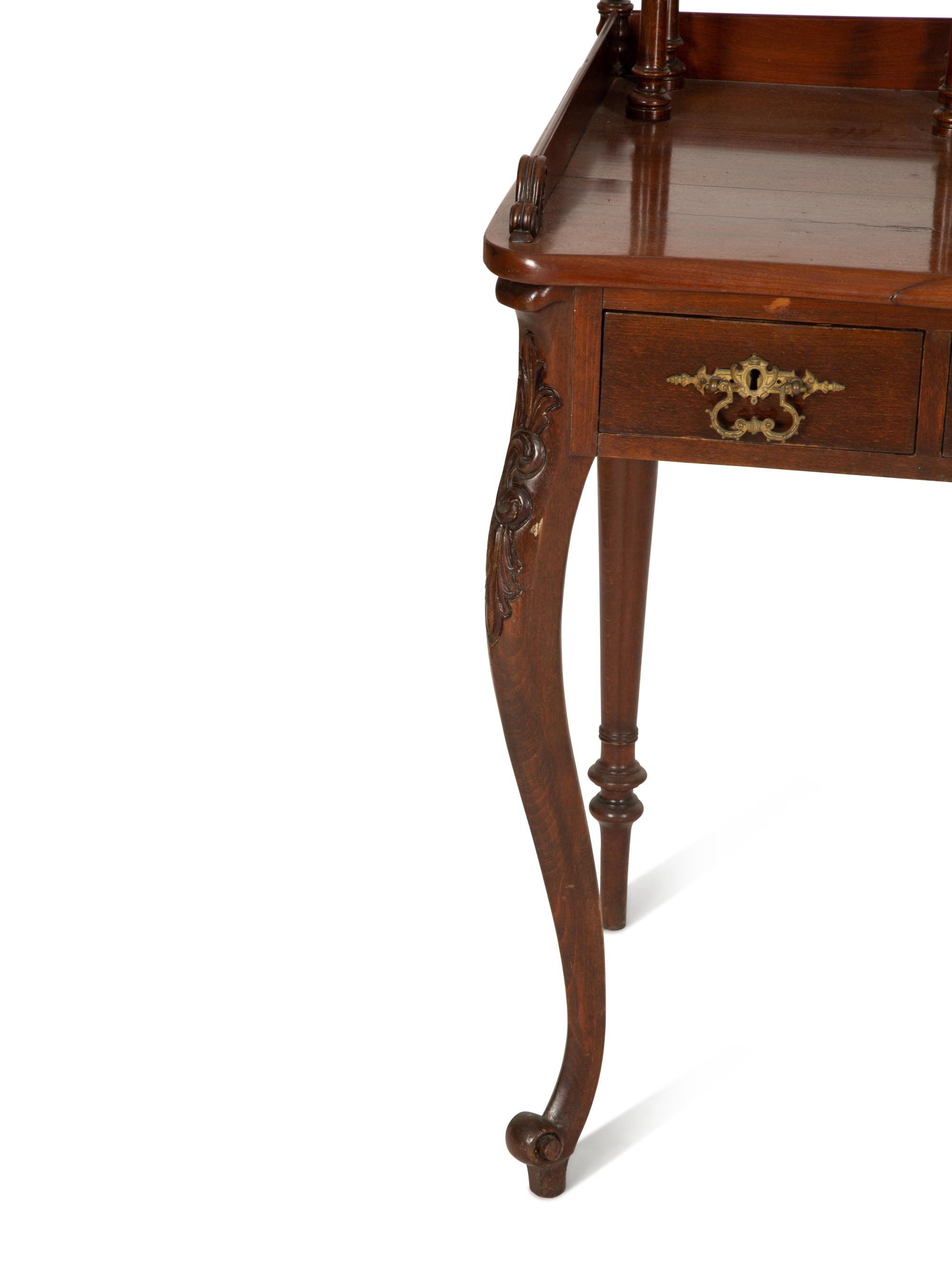 A Victorian Mahogany Lady's Writing Table with Shelf