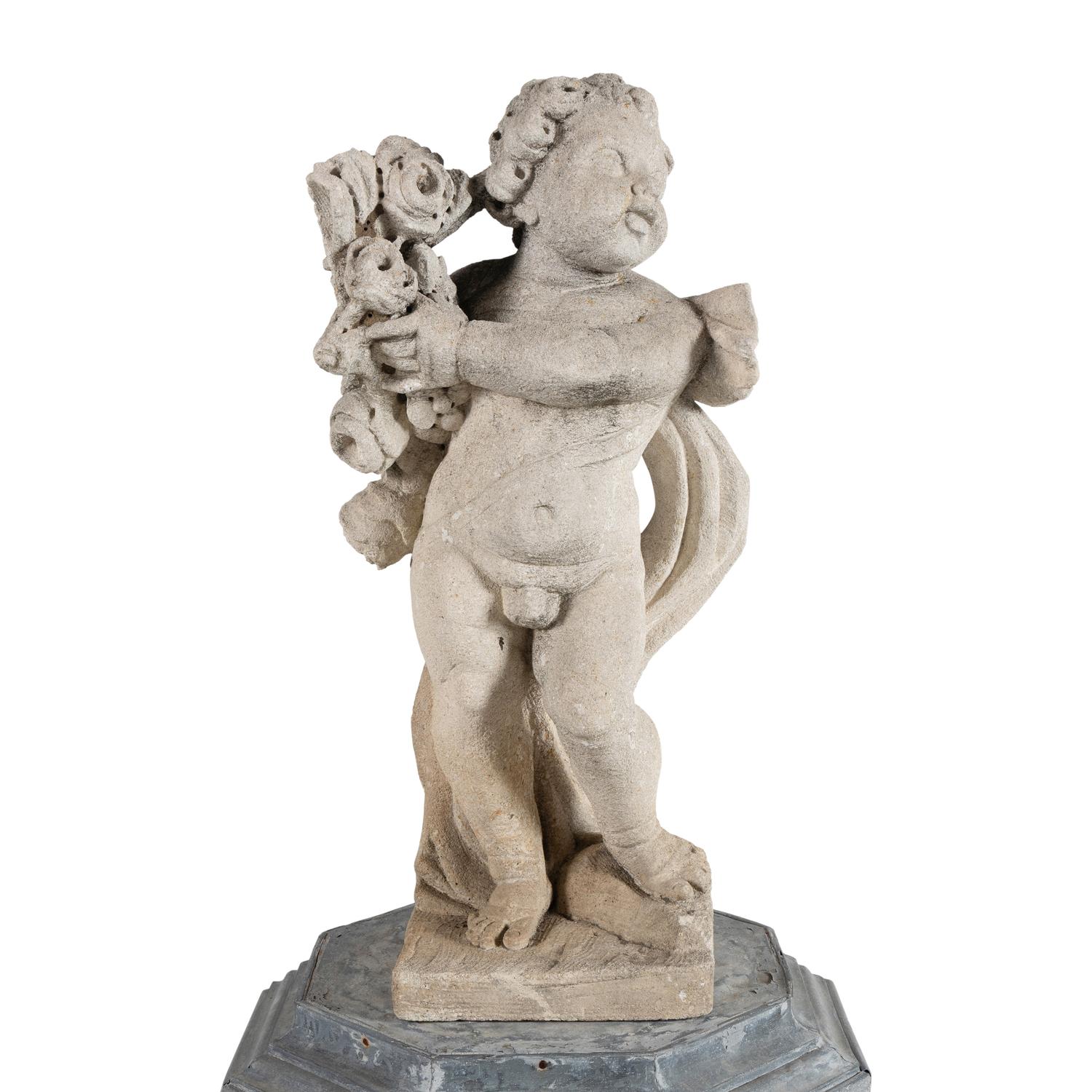 A Cast Stone Garden Figure of a Putto on a Zinc Pedestal