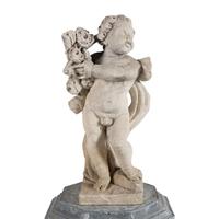 A Cast Stone Garden Figure of a Putto on a Zinc Pedestal