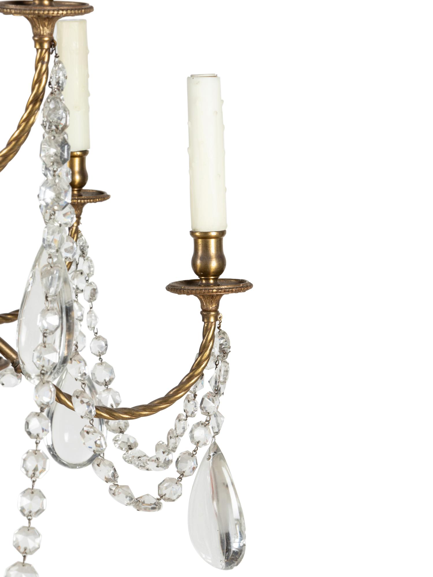 A French Brass and Glass Twelve-Light Chandelier with a Bell-Form Lantern