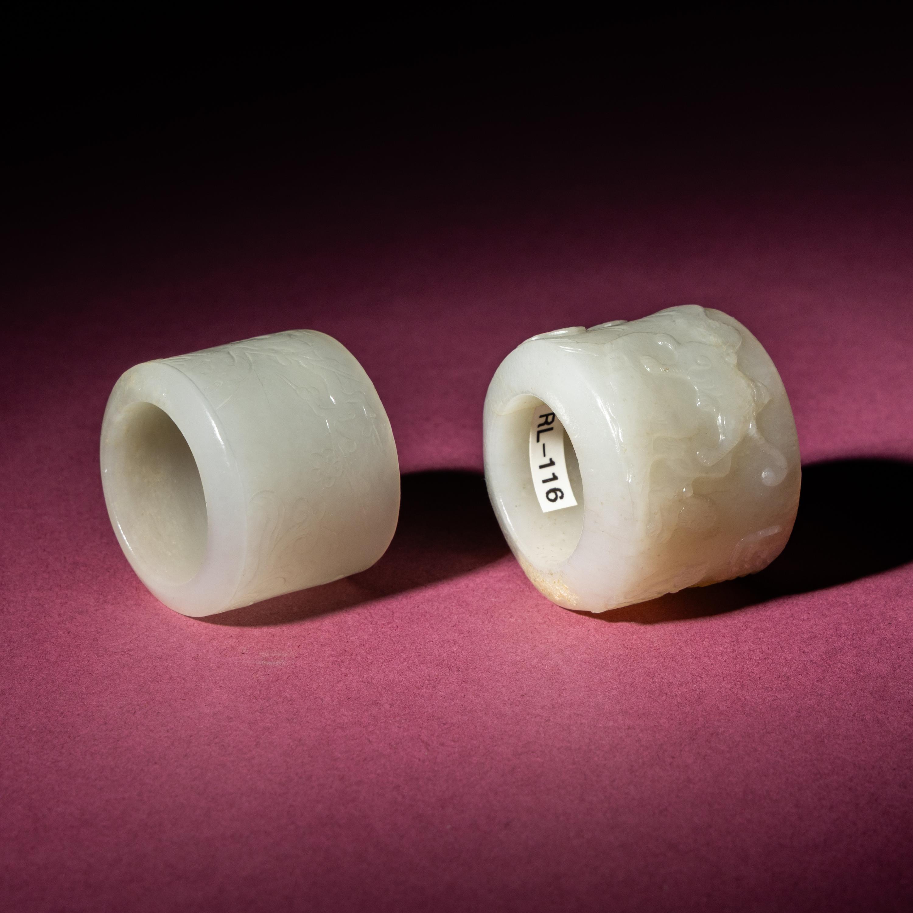 Two Chinese White Jade Carved and Inscribed Archer's Rings, 18th/19th Century — 清中期 白玉扳指兩枚