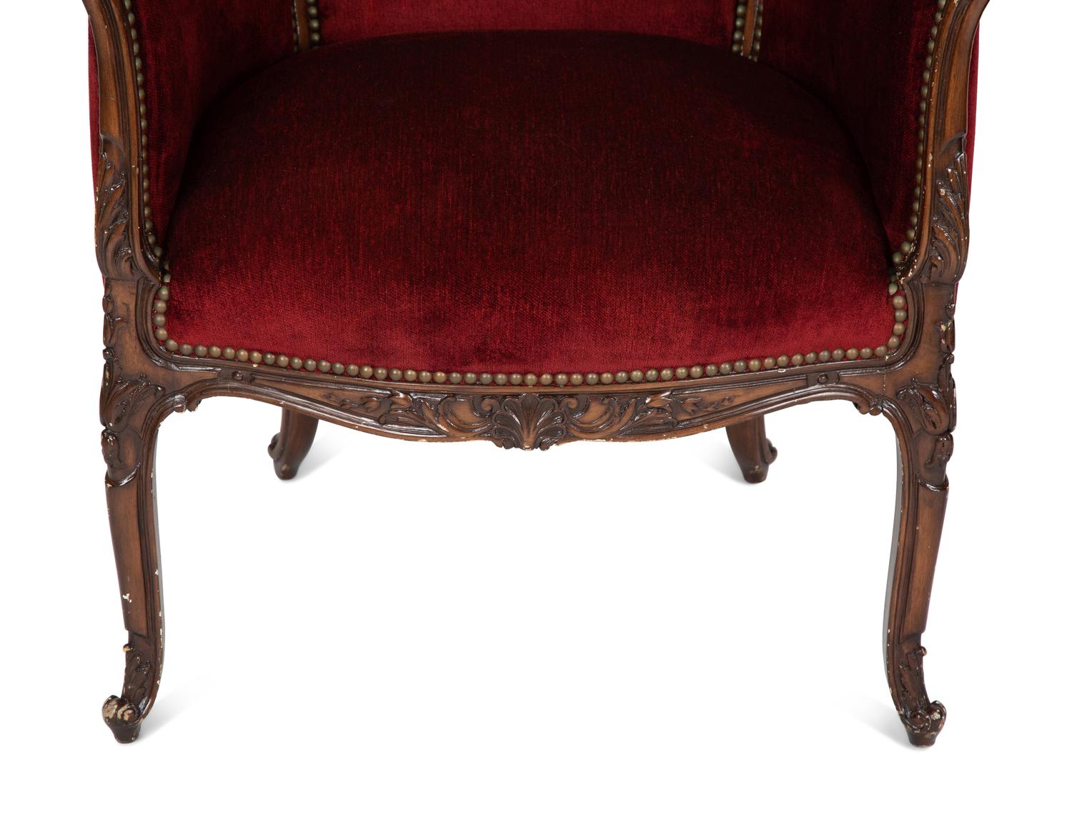 A Pair of Louis XV Style Walnut Bergères