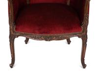 A Pair of Louis XV Style Walnut Bergères