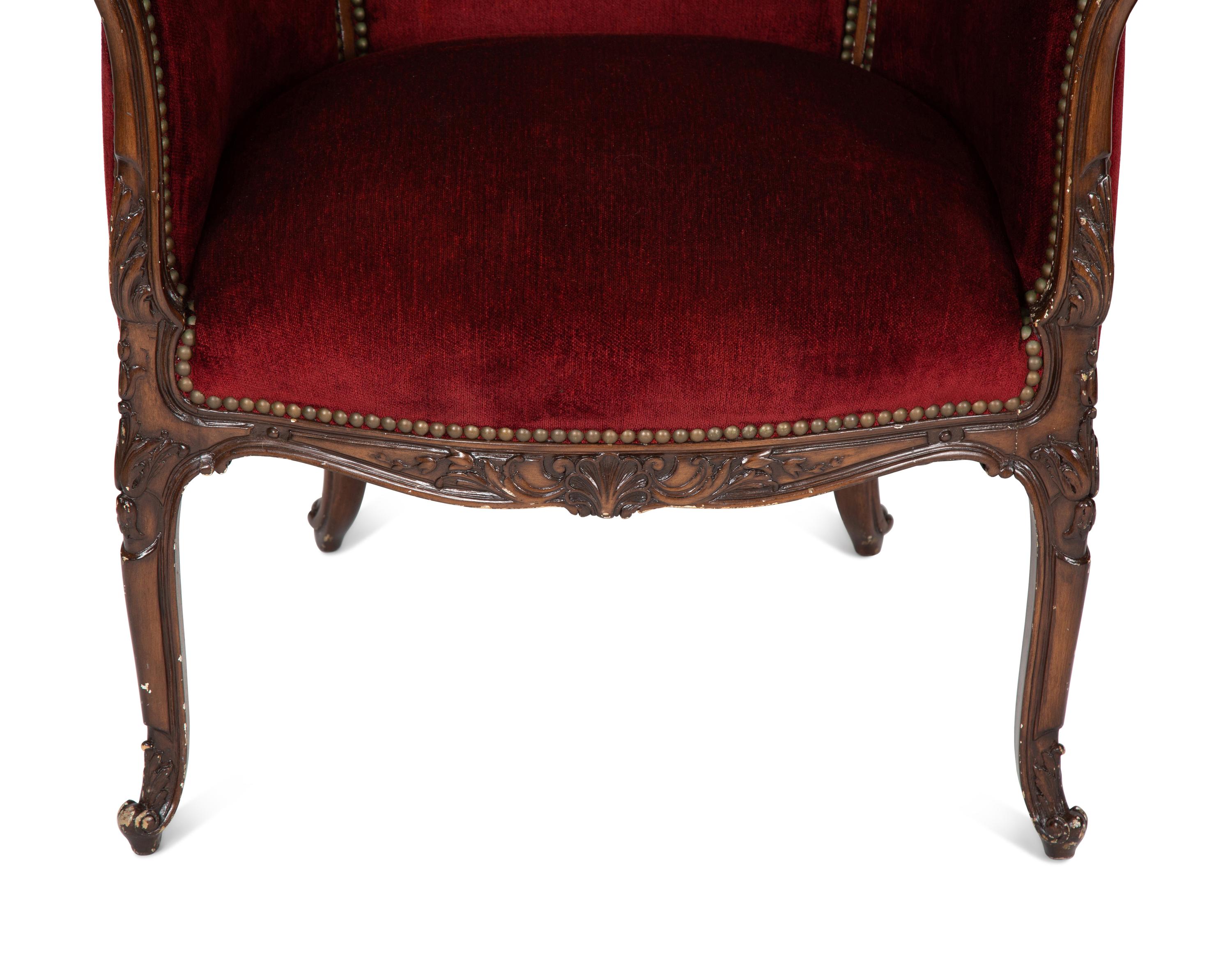 A Pair of Louis XV Style Walnut Bergères